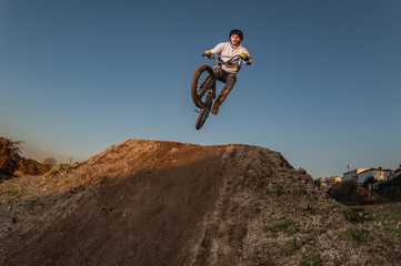 BMX Bike jump over a dirt trail
