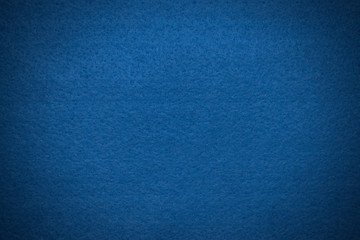 Blue felt texture with vignette closeup