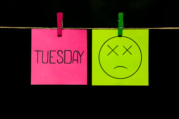 Copy space. Two stickers. On the yellow page is an expression of sadness to fainting. Tuesday.