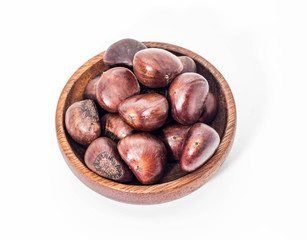 Close up of brown Chestnuts in the wooden cup