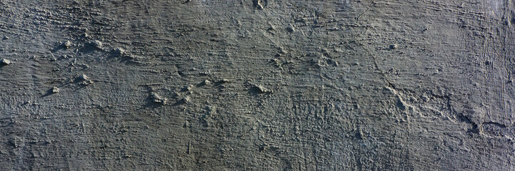 old cement plaster with traces of destruction. Web banner.