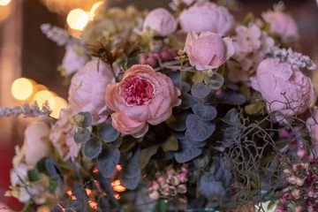 Beautiful bouquet of artificial flowers. Colorful artificial decorations and decor.