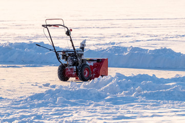 manual snowplow on a snow field