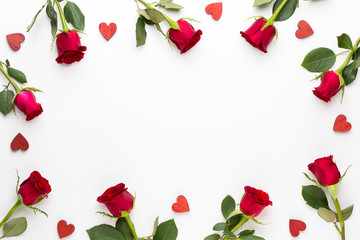 Flowers composition. Frame made of red rose on white background. Flat lay, top view, copy space.