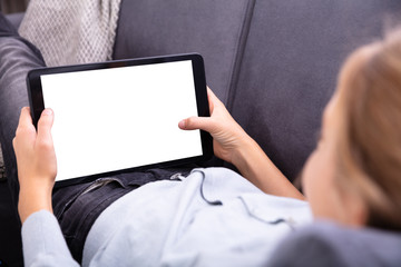 Close-up Of A Girl's Hand Using Digital Tablet