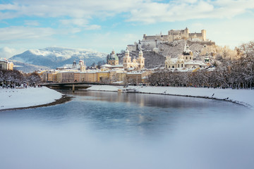Fototapeta na wymiar Panorama of Salzburg in winter: Snowy historical center, sunshine
