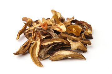 Dried mushrooms pile isolated on white background. Wild edible dried boletus mushrooms.
