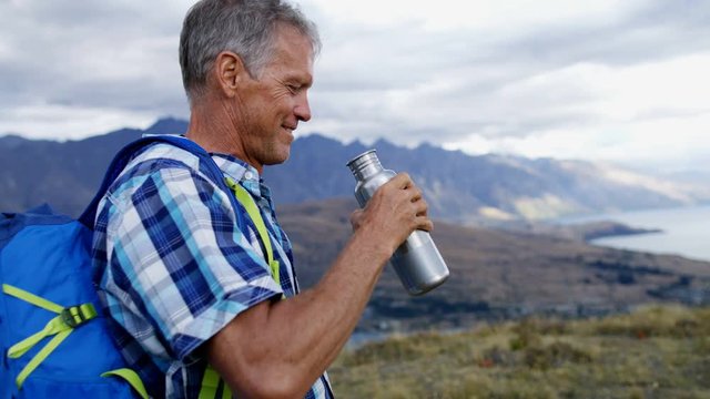 Senior male drinking water The Remarkables New Zealand