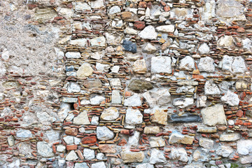 Patterns and textures of rock, stones and mortar in vintage street and wall construction in Sicily