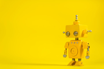 Robot on a yellow background.