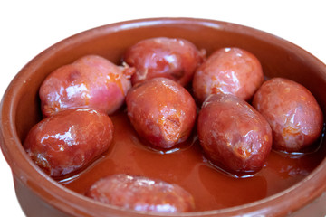 Spanish Tapas – Small Chorizo in Oil served in Bowl closeup