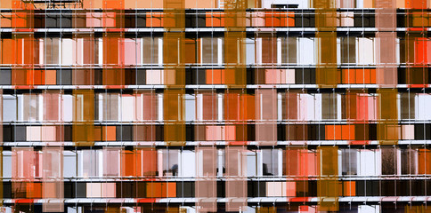 Graphic facade building of skyscraper - coral color
