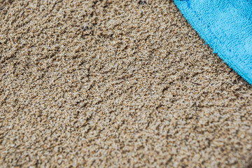 Colorful summer beachwear . towel on sand beach.
