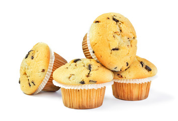 Delicious vanilla muffins with chocolate, isolated on white background. Muffins with paper, sweet food or unhealthy eating theme.