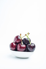 Fresh cherries on white background