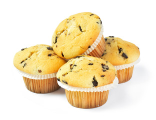 Delicious vanilla muffins with chocolate, isolated on white background. Muffins with paper, sweet food or unhealthy eating theme.