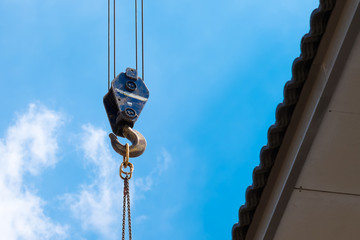 Crane Hook lifting  for construction on blue sky,steel hook and chain, copy space
