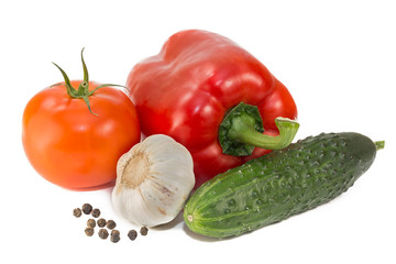Still life red bell pepper, tomato, cucumber, garlic and black pepper isolated on white background