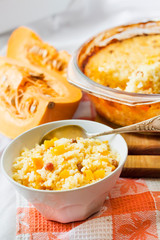 Milky cereal porridge with pumpkin and raisins