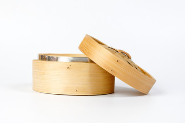 Wooden bamboo dim sum steamer on white background
