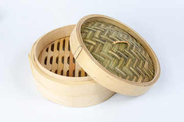 Wooden bamboo dim sum steamer on white background