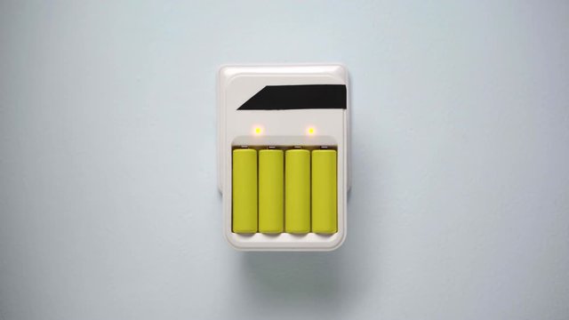 Battery wall charger plugget into wall socket.