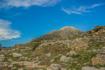 landscaping rocky valley foreground and mountain bare peak background in clear summer weather colorful time