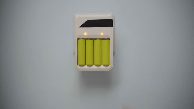 Battery wall charger plugget into wall socket.