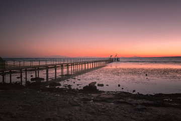 Fototapeta na wymiar The pier at sunrise
