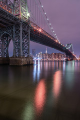 View on Williamsburg bridge at night from east river with long exposure
