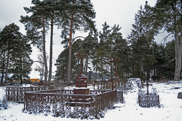 Very old christian cemetery in winter day