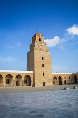 Fototapeta premium Great Mosque of Kairouan courtyard with minaret in Kairouan city in Tunisia also known as Mosque of Uqba