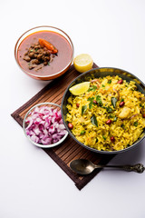 Aloo/Kanda Poha or Tarri Pohe with spicy chana masala/curry. selective focus