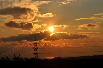 electricity pylons at sunset