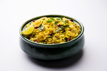 Aloo/Kanda Poha or Tarri Pohe with spicy chana masala/curry. selective focus