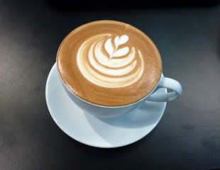 The white cup with coffee latte