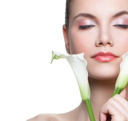 Young female face. Pretty woman with white flower isolated on white background, close up portrait