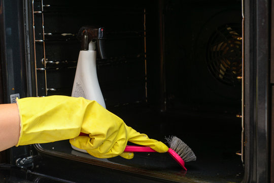 housework and housekeeping concept - close up of woman hand