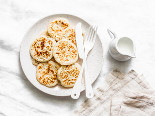 Sour dough pancakes - healthy breakfast, snack on a light background, top view