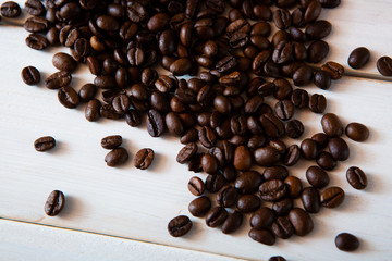 coffee beans on white wooden background