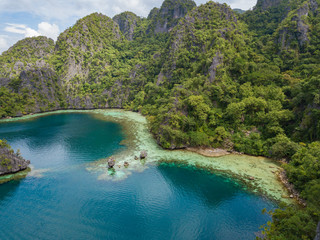Fototapeta na wymiar Aerial view to tropical lagoon with azure water near Kayangan Lake, Coron island. Palawan, Philippines.
