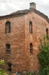 Old abandoned weathered retro vintage rural brick wall house