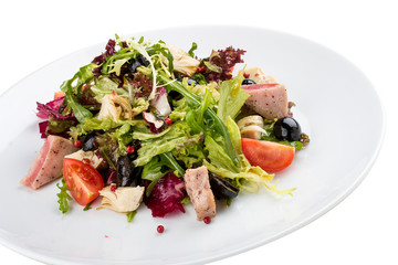 Salad with fried tuna and artichokes. On white background