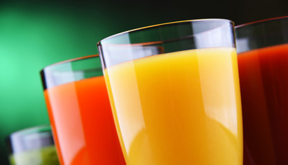 Glasses with fresh organic vegetable and fruit juices