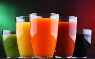 Glasses with fresh organic vegetable and fruit juices