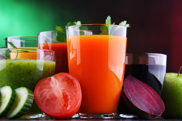 Glasses with fresh organic vegetable and fruit juices