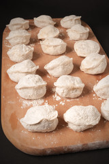 dumplings on a cutting board