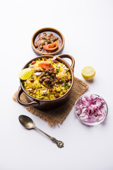 Aloo/Kanda Poha or Tarri Pohe with spicy chana masala/curry. selective focus