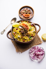 Aloo/Kanda Poha or Tarri Pohe with spicy chana masala/curry. selective focus