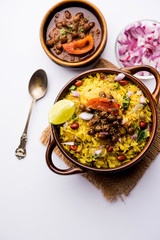 Aloo/Kanda Poha or Tarri Pohe with spicy chana masala/curry. selective focus